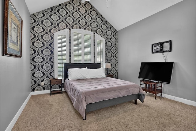 bedroom with vaulted ceiling and carpet floors