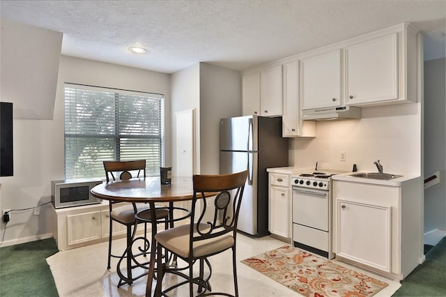 kitchen featuring white cabinetry and appliances with stainless steel finishes