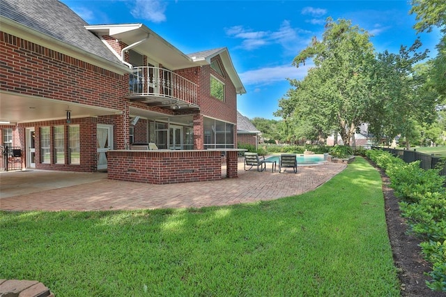 view of yard with a fenced in pool and a patio area