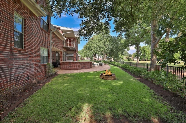 view of yard with an outdoor fire pit