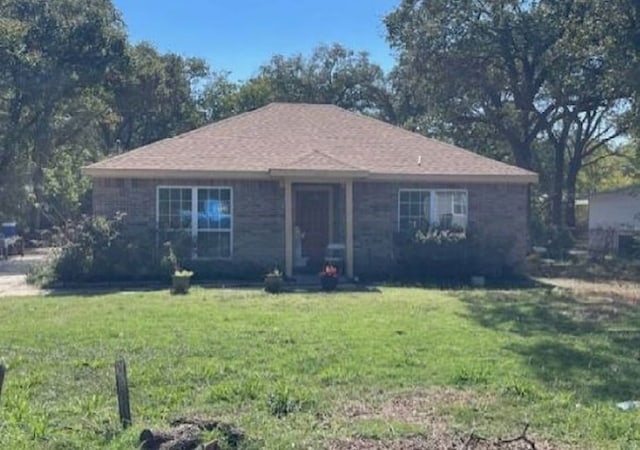 ranch-style house with a front yard