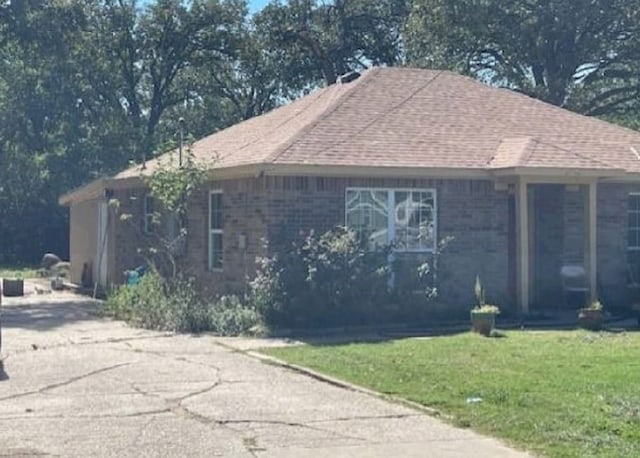 view of home's exterior with a lawn