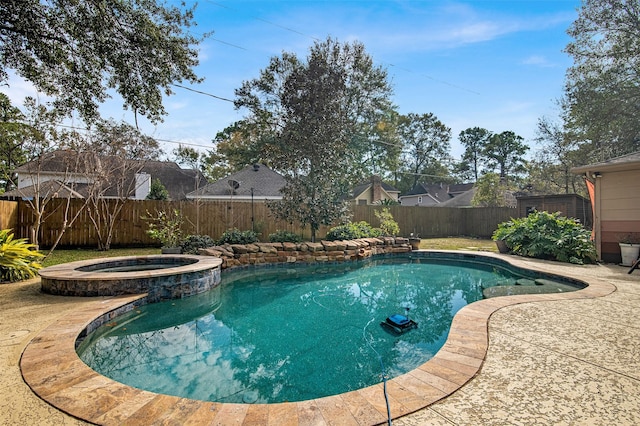 view of swimming pool with an in ground hot tub and a patio area