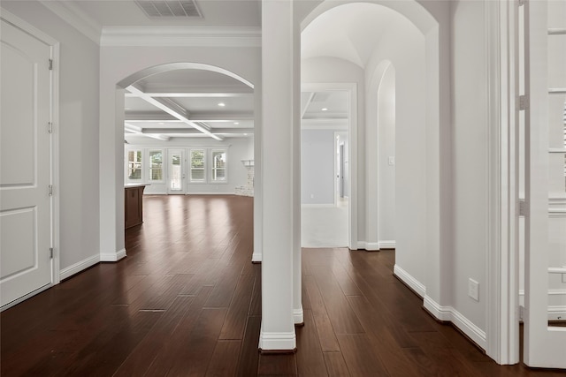 hall featuring dark hardwood / wood-style floors, coffered ceiling, crown molding, and beamed ceiling