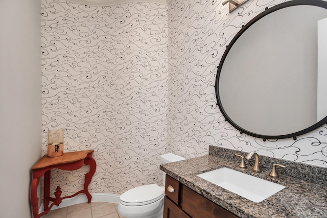 bathroom with vanity, tile patterned flooring, and toilet