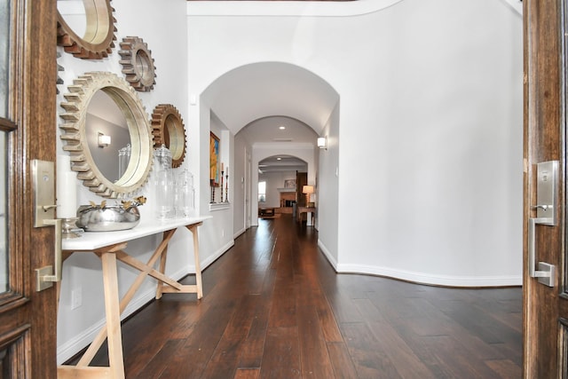 corridor featuring dark hardwood / wood-style floors