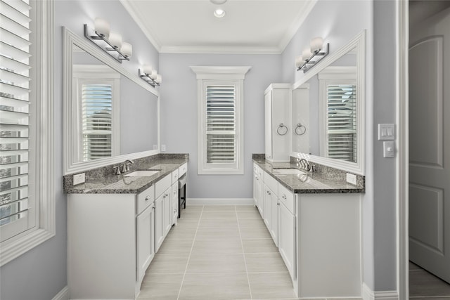 bathroom with tile patterned flooring, vanity, and ornamental molding