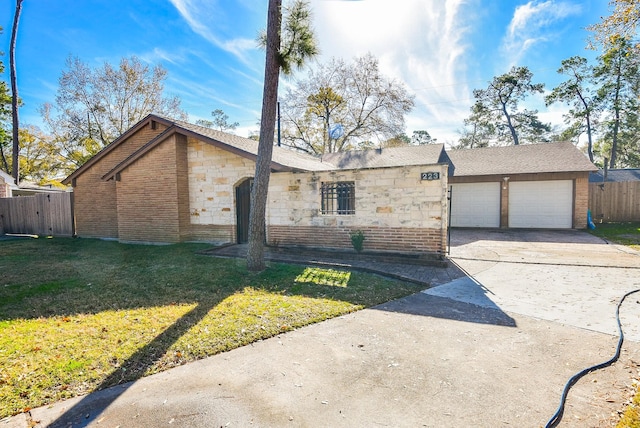 view of front facade featuring a garage and a front lawn