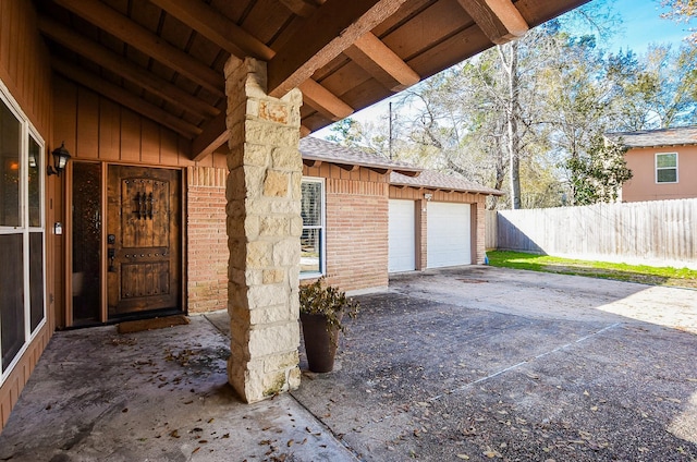 view of exterior entry featuring a garage