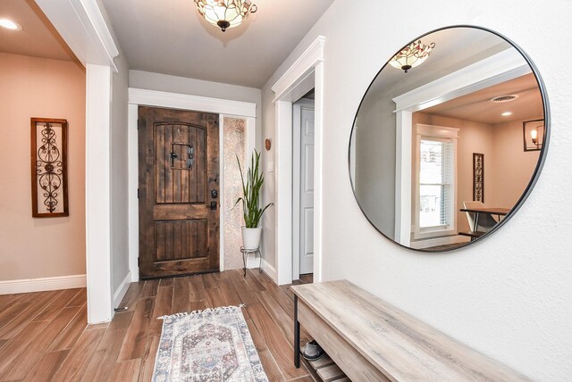 foyer entrance featuring hardwood / wood-style floors