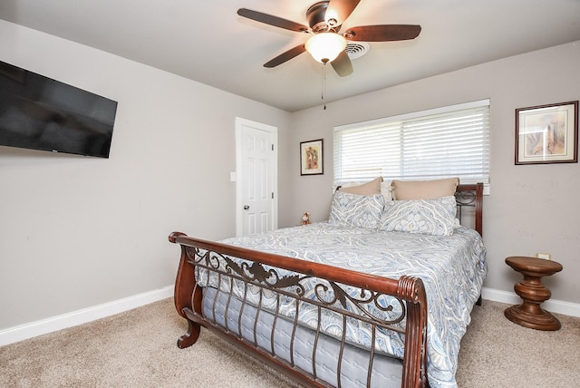 bedroom featuring ceiling fan and carpet