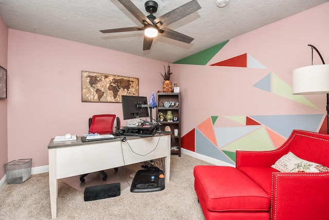 office with ceiling fan, carpet, and a textured ceiling