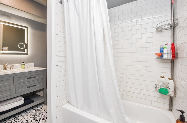 bathroom featuring vanity and shower / bathtub combination with curtain