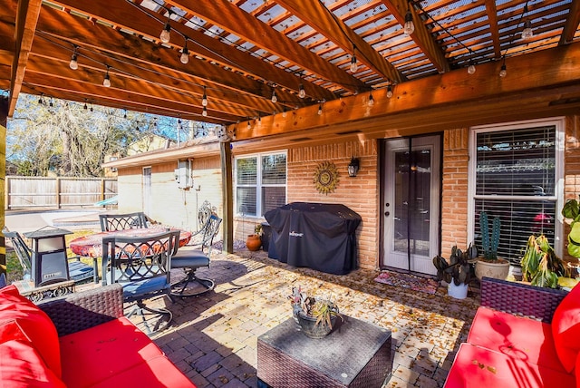 view of patio / terrace featuring area for grilling, a pergola, and an outdoor hangout area