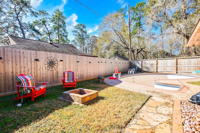 view of yard featuring a patio and an outdoor fire pit