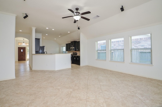 unfurnished living room featuring light tile patterned floors, crown molding, vaulted ceiling, and ceiling fan