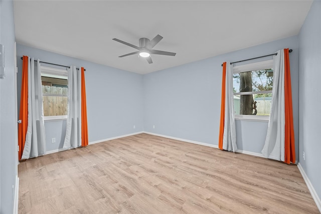 empty room featuring ceiling fan and light wood-type flooring