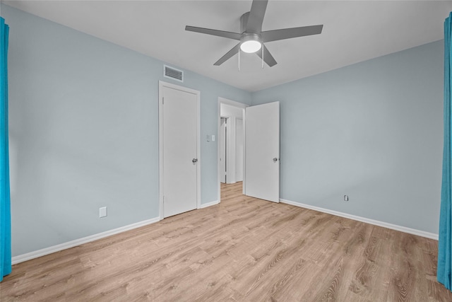 unfurnished bedroom featuring ceiling fan and light hardwood / wood-style flooring