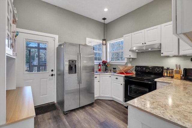 kitchen with pendant lighting, stainless steel fridge, electric range, light stone countertops, and white cabinets