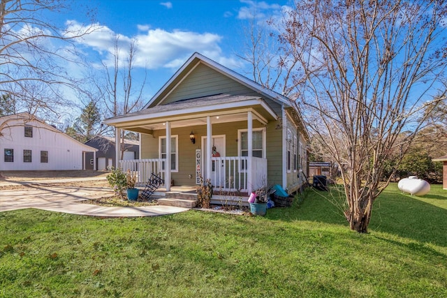 bungalow featuring a front yard and a porch