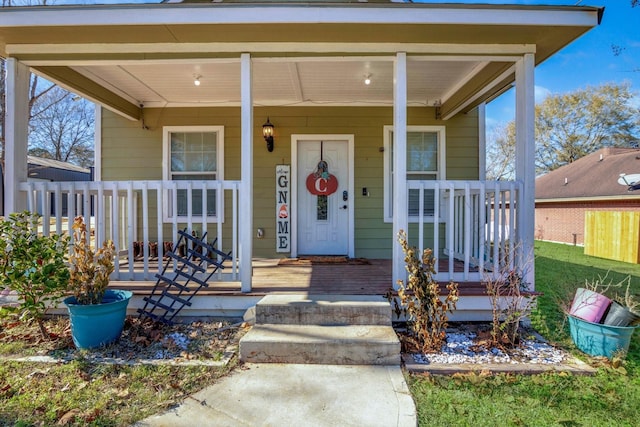 doorway to property featuring covered porch