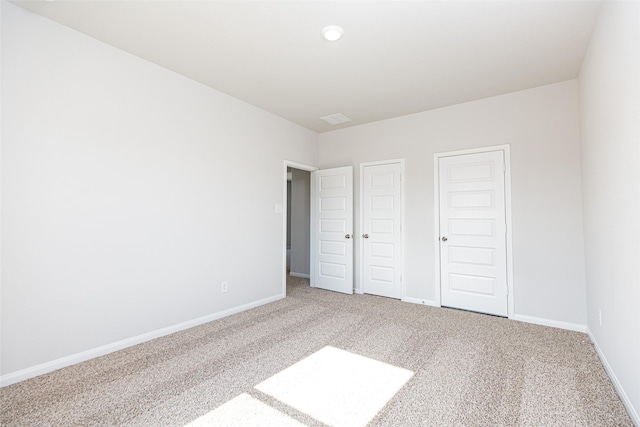 unfurnished bedroom featuring carpet