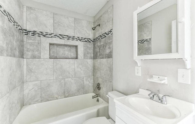 full bathroom featuring vanity, toilet, and tiled shower / bath combo