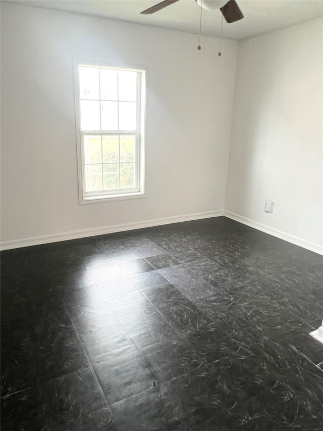 empty room featuring ceiling fan