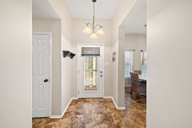 foyer featuring a notable chandelier