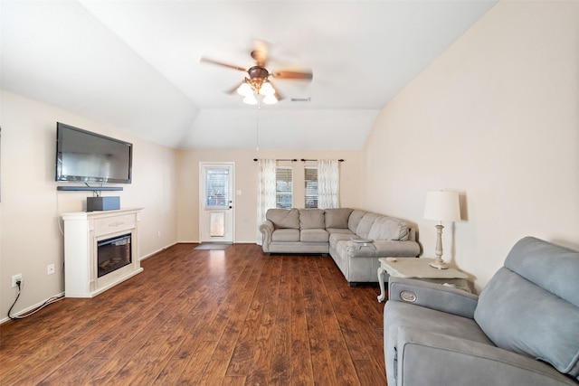 living room featuring ceiling fan, lofted ceiling, and dark hardwood / wood-style flooring