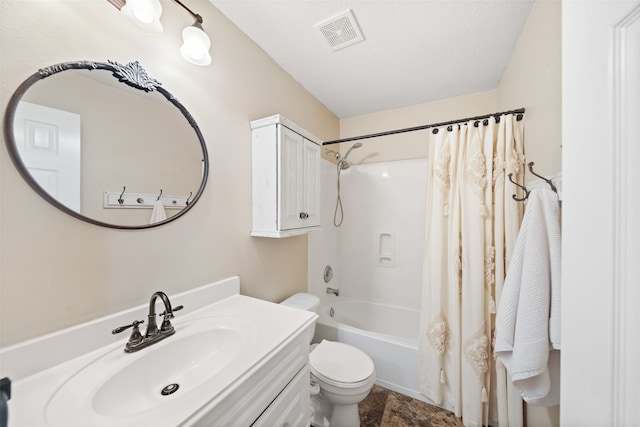 full bathroom with shower / bath combination with curtain, vanity, toilet, and a textured ceiling