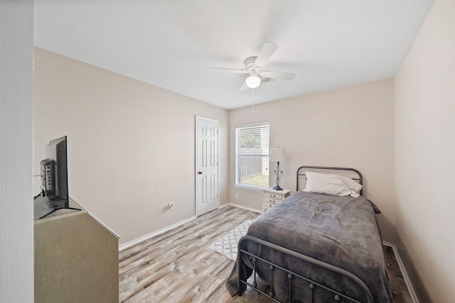 bedroom with ceiling fan and light wood-type flooring