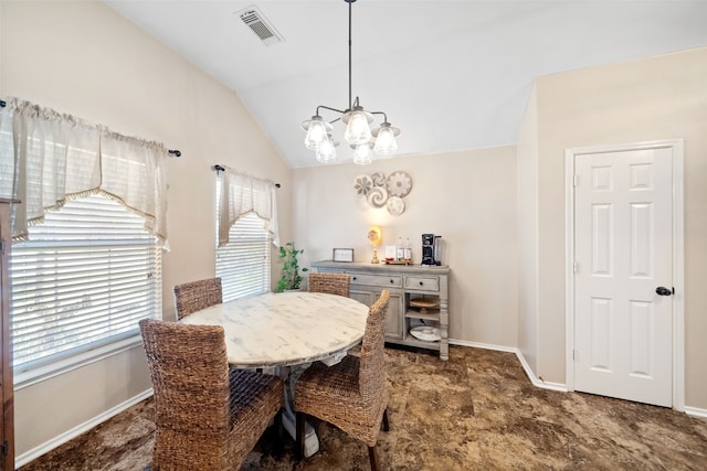 dining area with vaulted ceiling and a chandelier