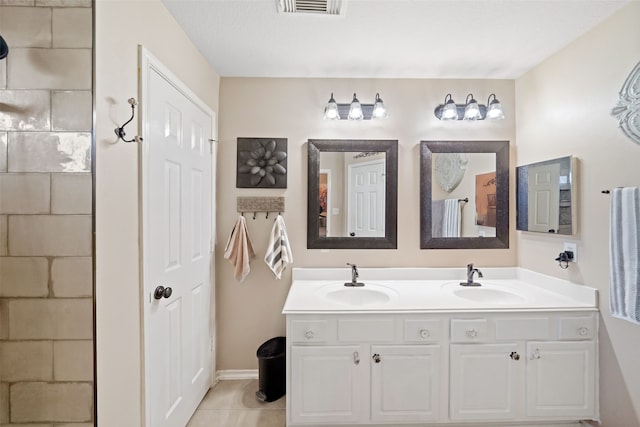 bathroom with vanity and tile patterned floors