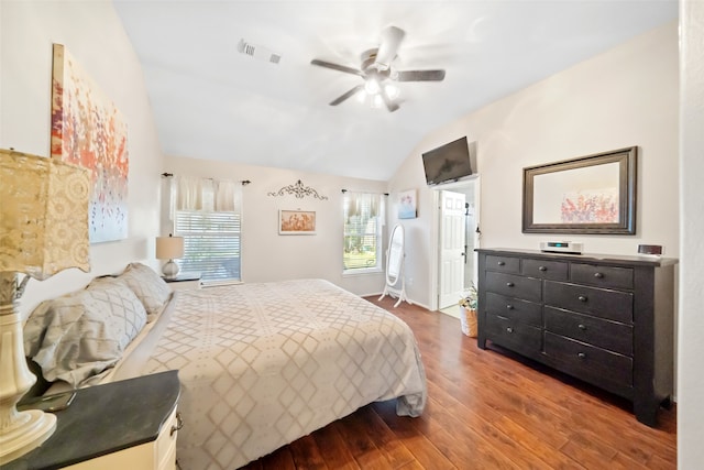 bedroom with ceiling fan, wood-type flooring, and vaulted ceiling