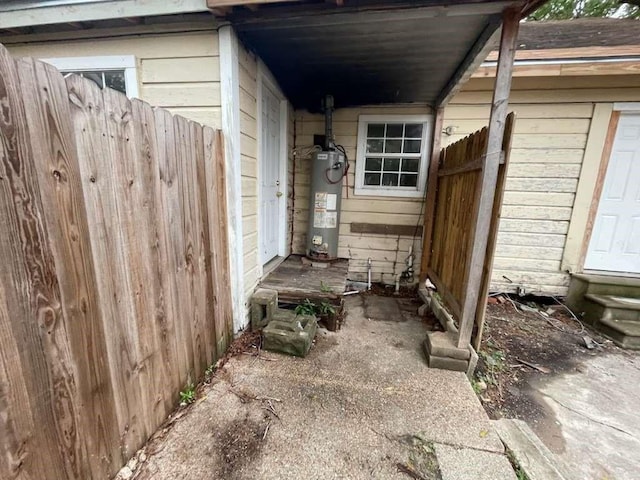 view of home's exterior with gas water heater