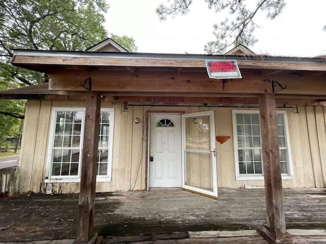 entrance to property with a deck