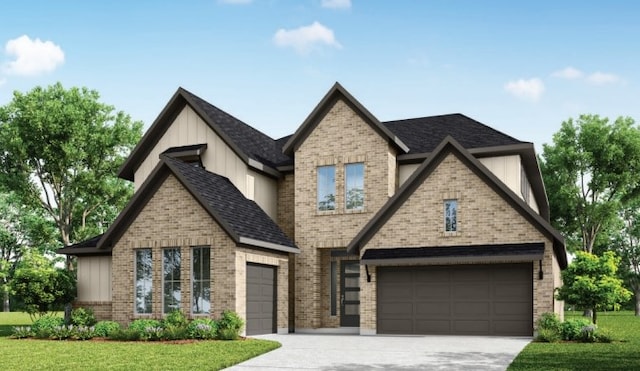 view of front of property with a garage and a front lawn