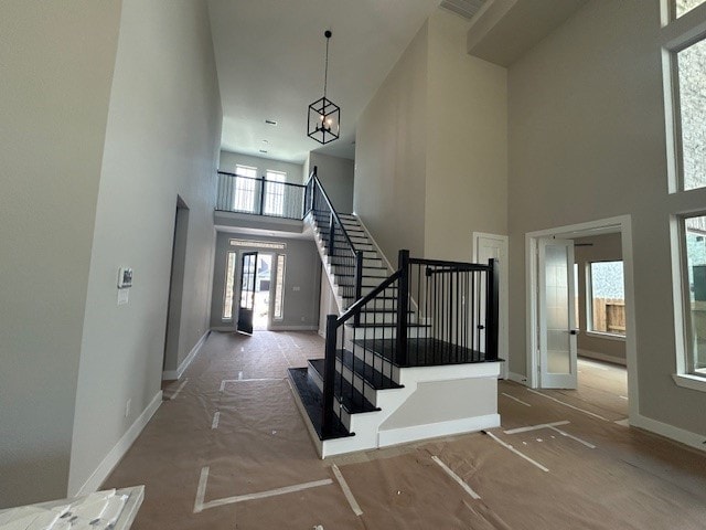 4423 Southpoint Way, Fulshear, TX 77441 - entryway featuring a high ceiling, stairway, and baseboards