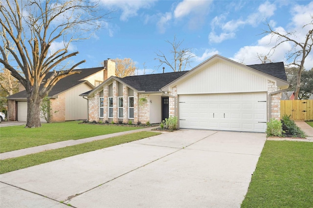 single story home with a garage and a front lawn