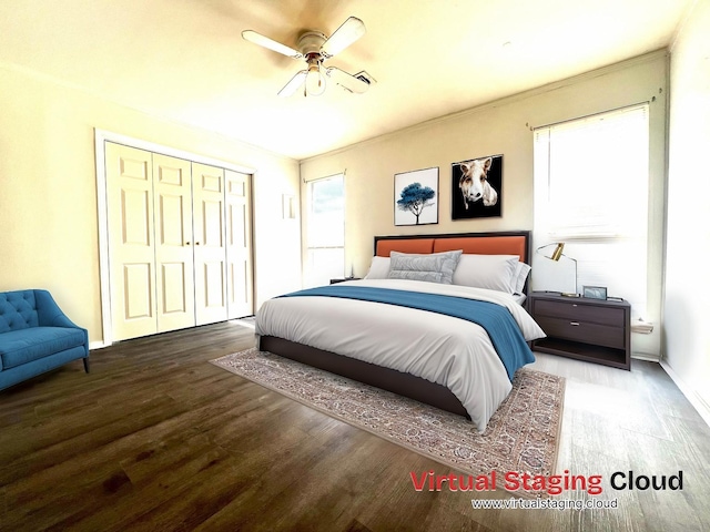 bedroom with hardwood / wood-style flooring, ceiling fan, and a closet