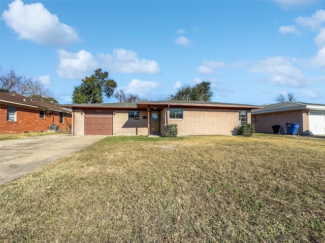 single story home featuring a garage and a front lawn