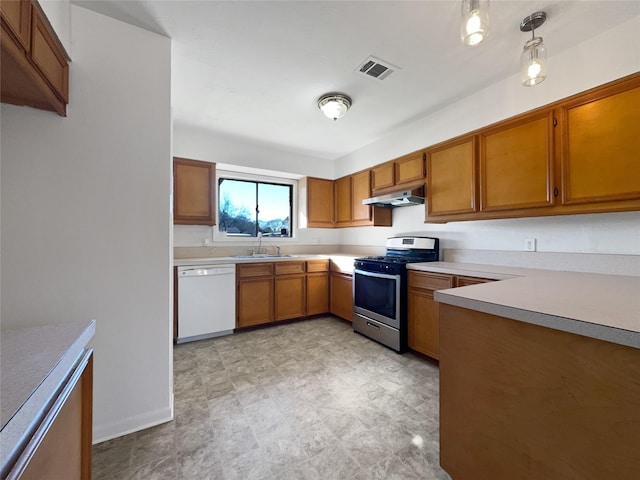 kitchen featuring sink, decorative light fixtures, stainless steel gas range, and dishwasher