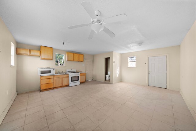 kitchen with white appliances and ceiling fan