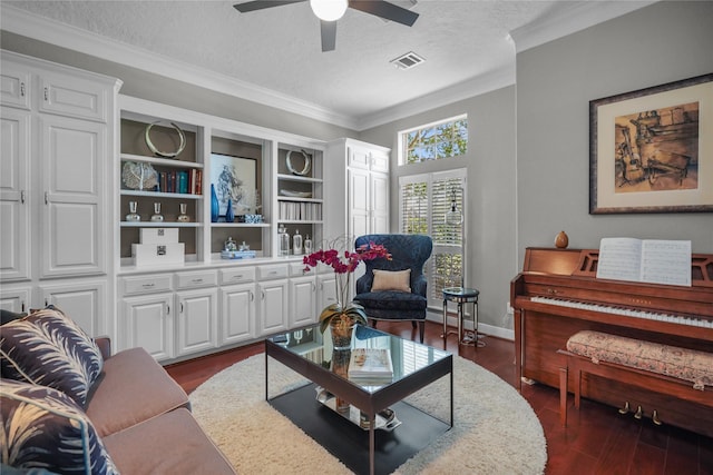 interior space with dark hardwood / wood-style flooring, ceiling fan, crown molding, and a textured ceiling