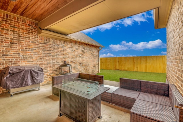 view of patio featuring a grill and an outdoor hangout area