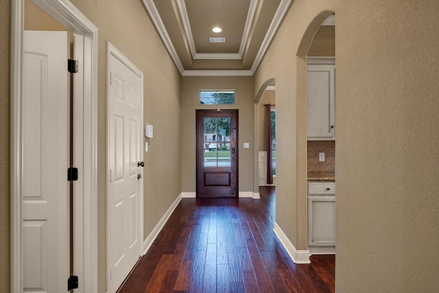 entryway with crown molding and dark hardwood / wood-style floors