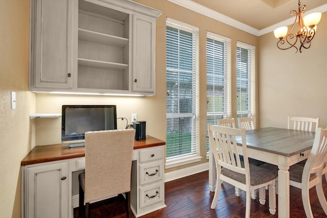 office space featuring dark wood-type flooring, crown molding, and a chandelier