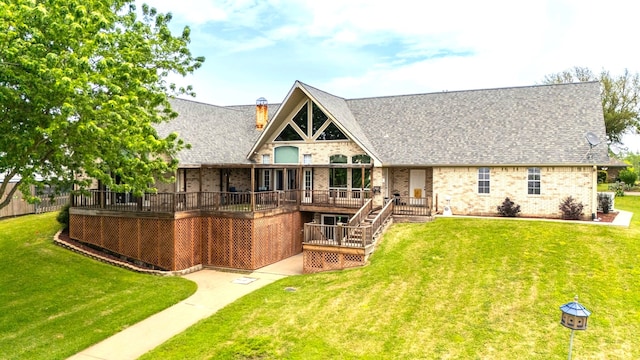 back of house featuring a yard and a deck