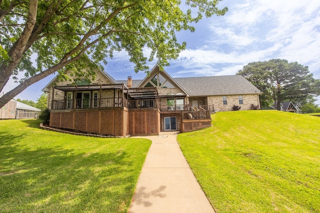 view of front of house with a front yard and a deck